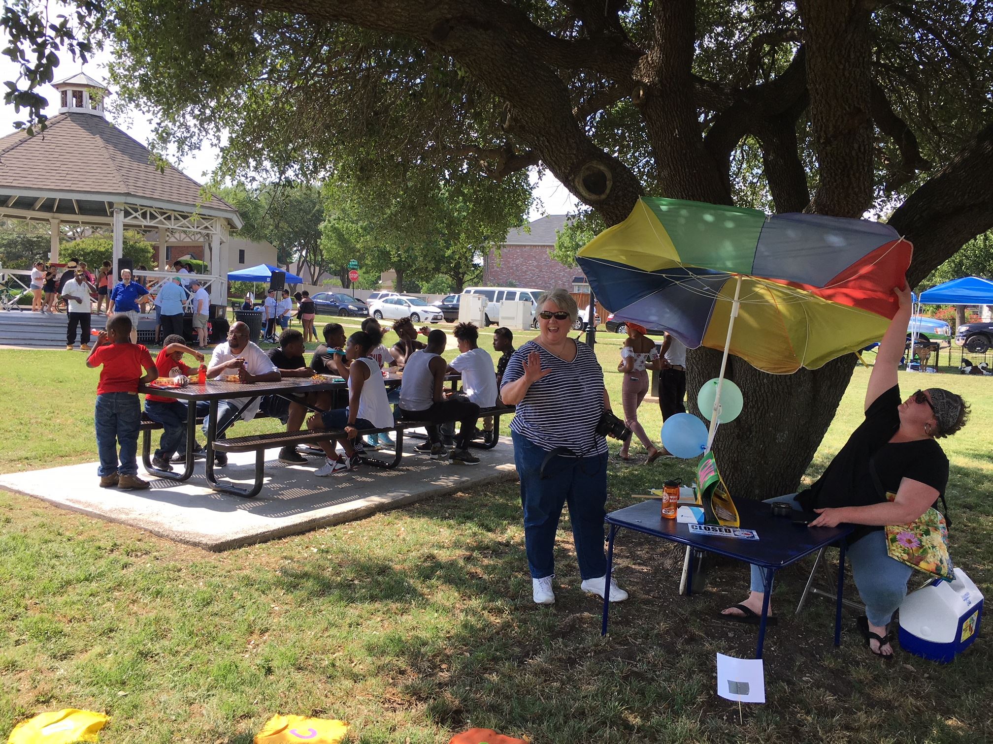 Children Gathered Around a Table in the Park